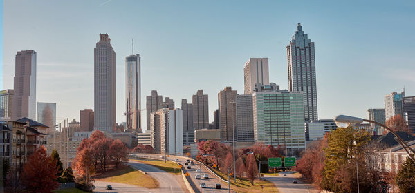 Panoramic view of buildings in city against sky