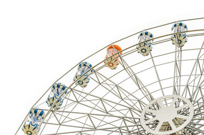 Low angle view of ferris wheel against clear sky