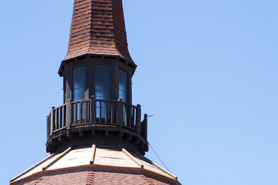 Low angle view of building against blue sky