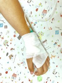 Cropped hand with iv drip on hand