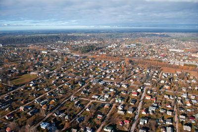 High angle view of city buildings against sky