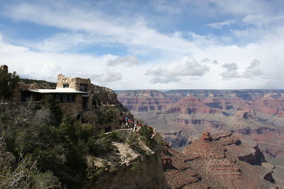 Buildings against cloudy sky