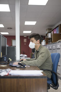 Man working on table in office