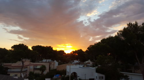 Silhouette of built structure at sunset