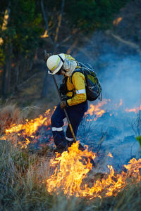 Low section of man working on field