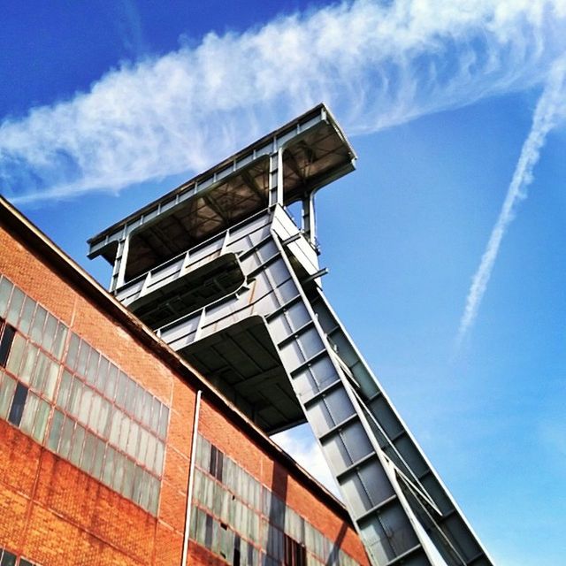 architecture, building exterior, built structure, low angle view, sky, window, building, blue, residential building, residential structure, city, cloud, day, outdoors, modern, cloud - sky, no people, apartment, balcony, exterior