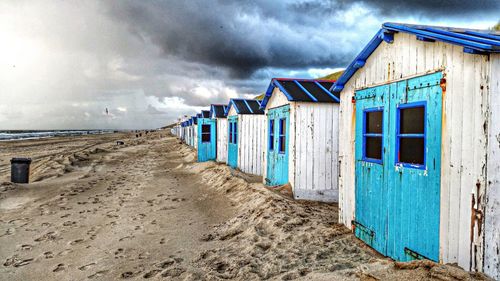 View of beach against cloudy sky