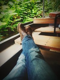 Low section of man sitting on floor