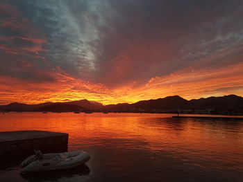 Scenic view of lake against sky during sunset