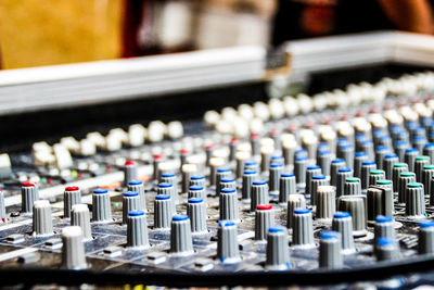 Close-up of sound mixer in recording studio