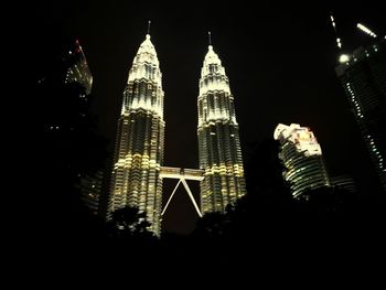 Low angle view of illuminated city at night