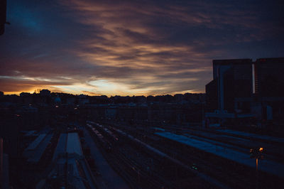 High angle view of railroad tracks against sky during sunset