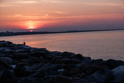 Scenic view of sea at sunset