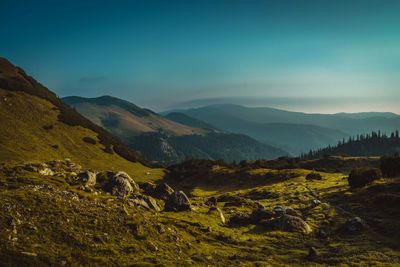 Scenic view of landscape and mountains against sky