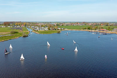 Boats in sea against sky