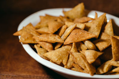 Close-up of pasta served in plate on table