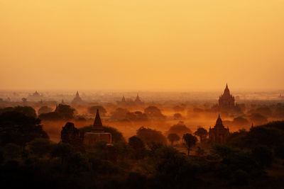 Panoramic view of temple building against sky during sunset