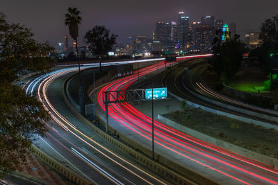 High angle view of light trails on highway at night