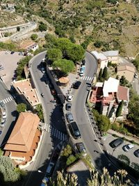 High angle view of road amidst trees in city