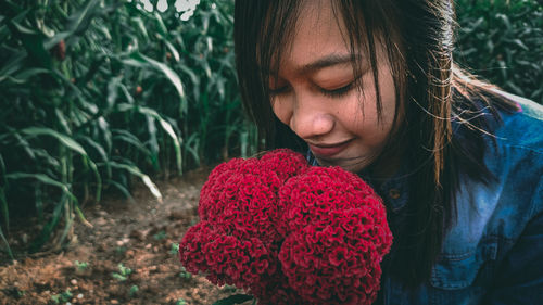 Portrait of woman with red leaves