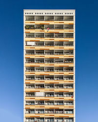 Low angle view of building against clear blue sky