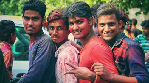 Portrait of young man and friends