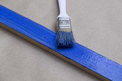 High angle view of paintbrush on floor