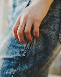 Midsection of woman wearing ring