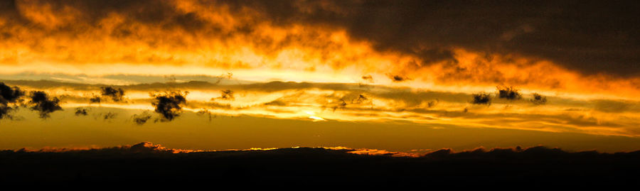 Scenic view of dramatic sky during sunset