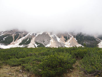 Scenic view of mountains against sky during winter