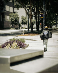 Man with bag on street in city