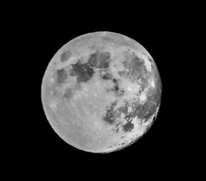 Low angle view of moon against sky at night