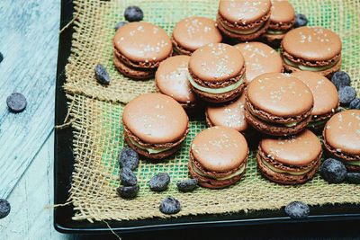 High angle view of macaroons in plate at home