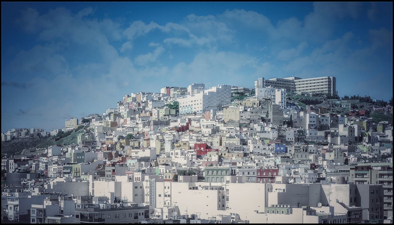 BUILDINGS AGAINST BLUE SKY