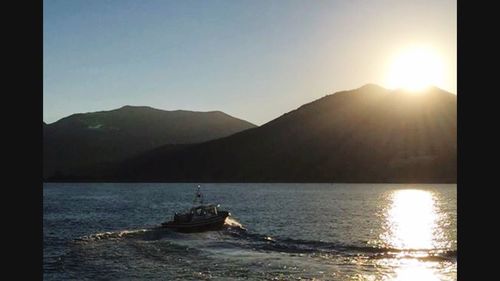 Boat sailing in sea during sunset