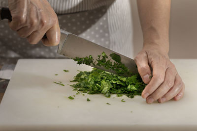 Midsection of man preparing food in kitchen