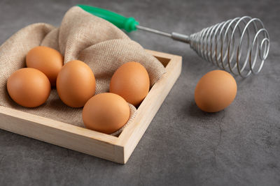 High angle view of eggs in container on table
