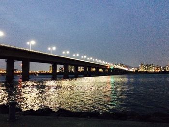 Reflection of illuminated built structure in water