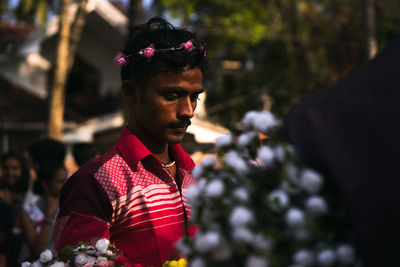 Close-up of young woman standing outdoors