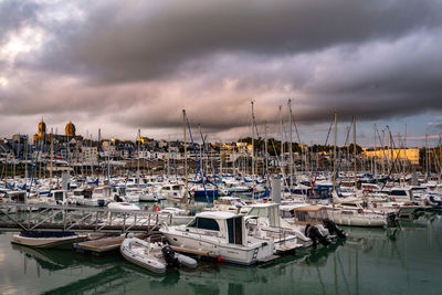 Boats moored at harbor