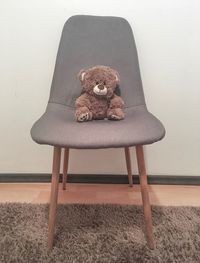 Stuffed toy on chair at home