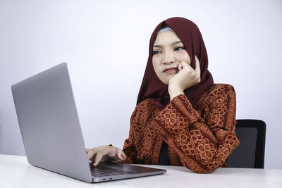 Young woman using mobile phone