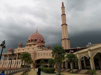 View of temple building against cloudy sky