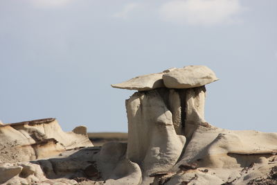 Close-up of stone wall against sky