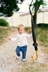 Full length of a boy playing with baby