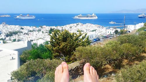 High angle view of woman by sea in town