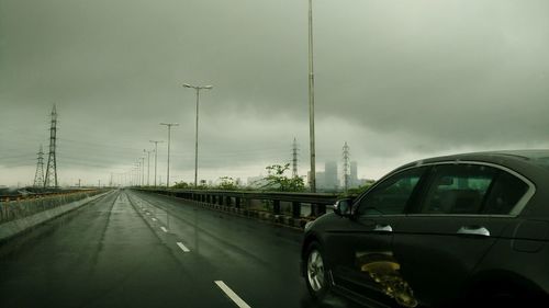 Road against cloudy sky