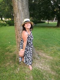 Portrait of happy girl standing in park
