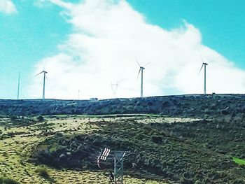 Wind turbines on field