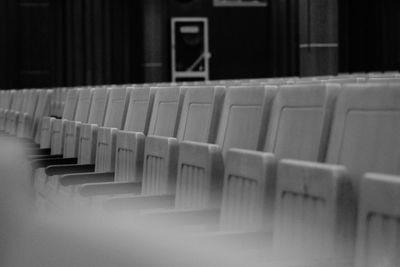 Close-up of chairs in row